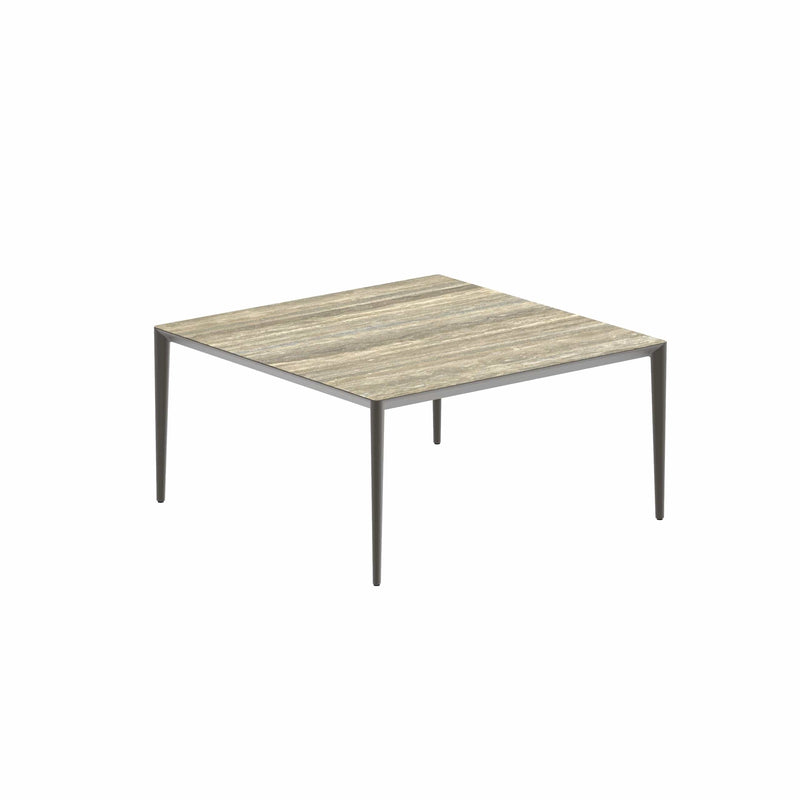 Royal Botania Tafel Gepoedercoat aluminium Brons / Travertino Royal Botania U-nite Tafel  150x150x75cm. Diverse kleuren frames en tafelbladen mogelijk.