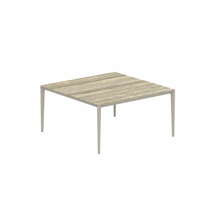 Royal Botania Tafel Gepoedercoat aluminium Pebble / Travertino Royal Botania U-nite Tafel  150x150x75cm. Diverse kleuren frames en tafelbladen mogelijk.